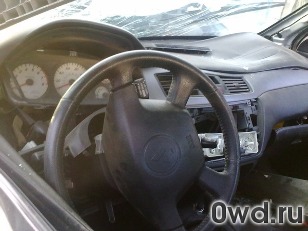 Битый автомобиль Mitsubishi Lancer Cedia